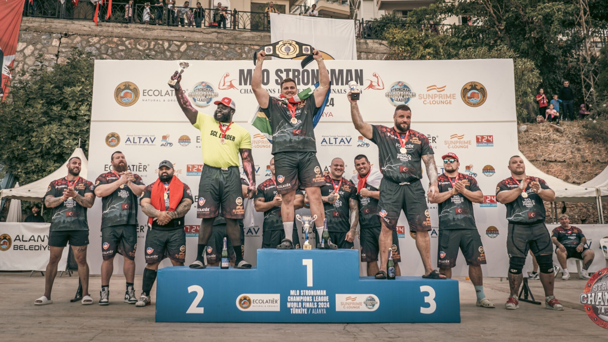 Strongman Champions League 2024 Finals in Turkiye, strongman athletes standing on a podium celebrating the win