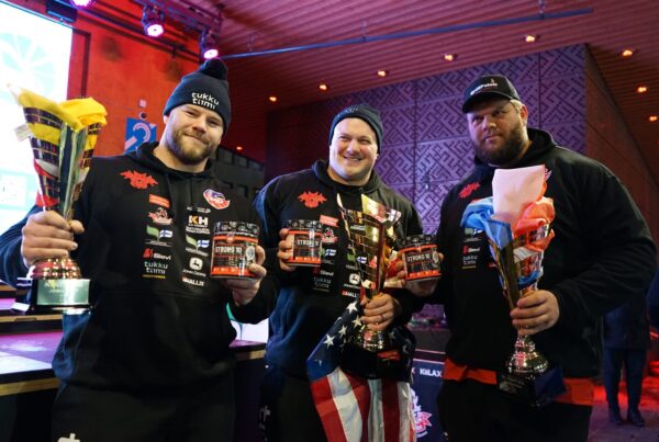 Brian Kichton, Kevin Hazeleger, and Patrick Eibel celebrating their podium finish at ICEMAN 2025, holding trophies and supplement containers.